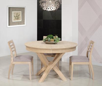 Table ronde Contemporaine Romain, diamtre 130 cm ralise en chne avec un pieds central et 1 allonge portefeuille de 50 cm