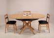 Table ronde Contemporaine Romain, diamtre 120 cm ralise en chne avec un pieds central et 1 allonge portefeuille de 50 cm